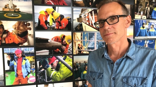 researcher Örjan Gustafsson infront of images from an expedition to the Arctic